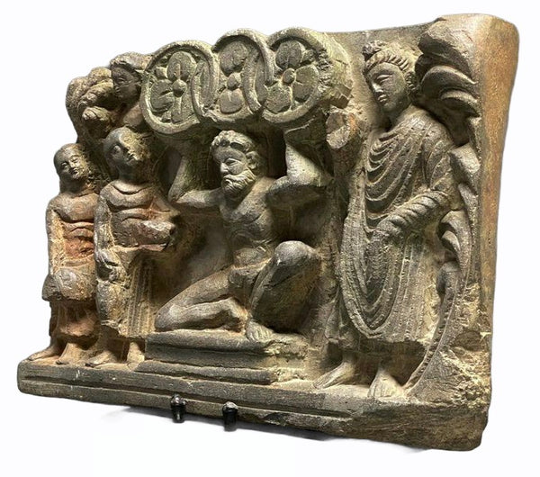 Schist Panel with Atlas holding the Three Wheels  - Gandhara - 200/300 AD